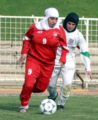 Iranian and German football players during last year's match in Tehran.